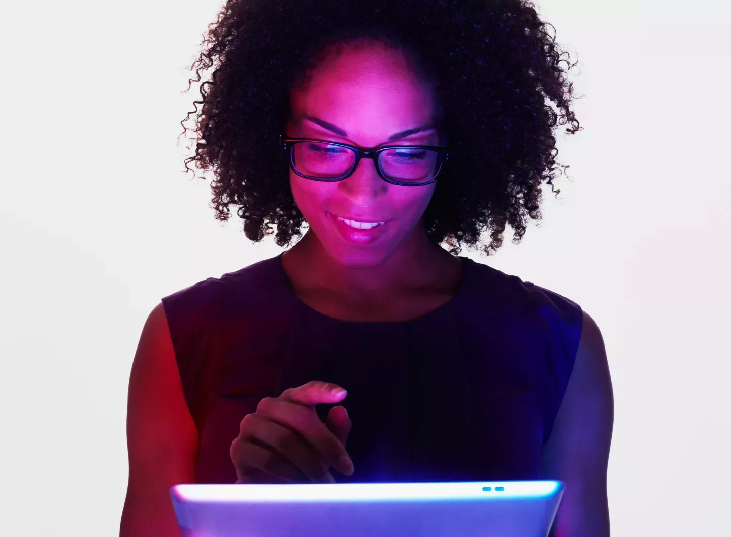 person sitting in the dark with the glow of laptop lighting up face person sitting in the dark with the glow of laptop lighting up face