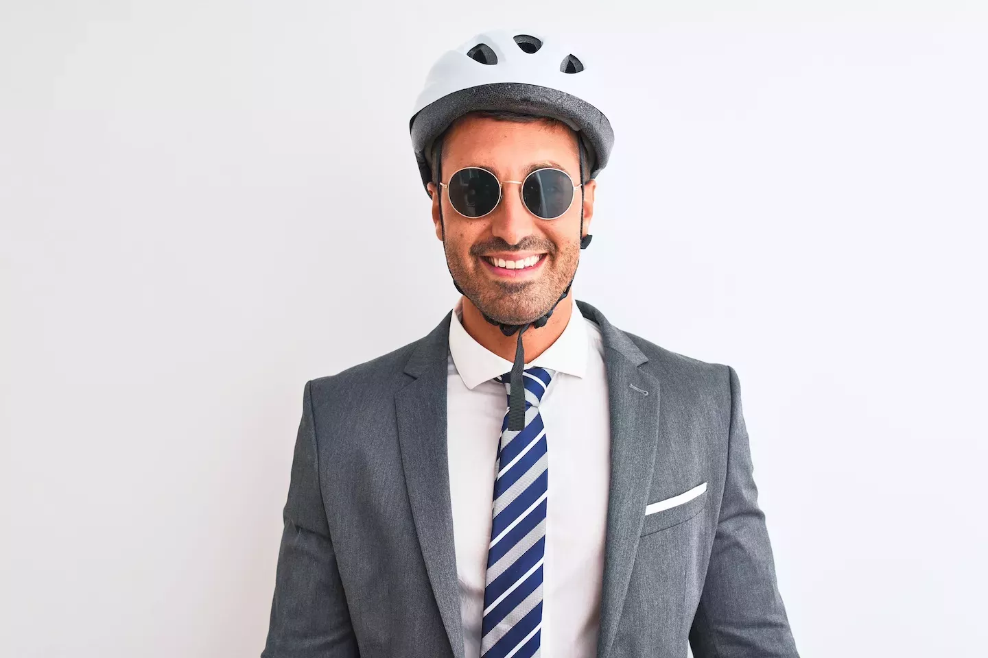 Man in a suit wearing a helmet Man in a suit wearing a helmet