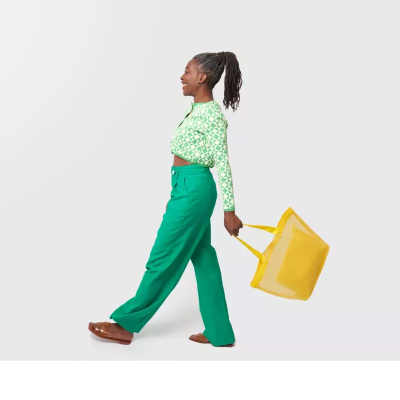 Woman walking with a shopping bag Woman walking with a shopping bag