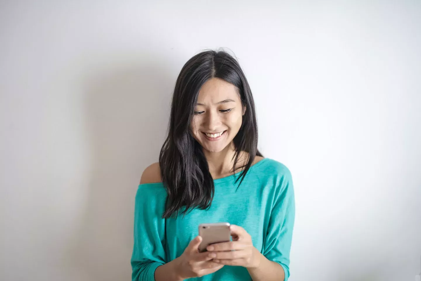 Happy woman using a phone Happy woman using a phone