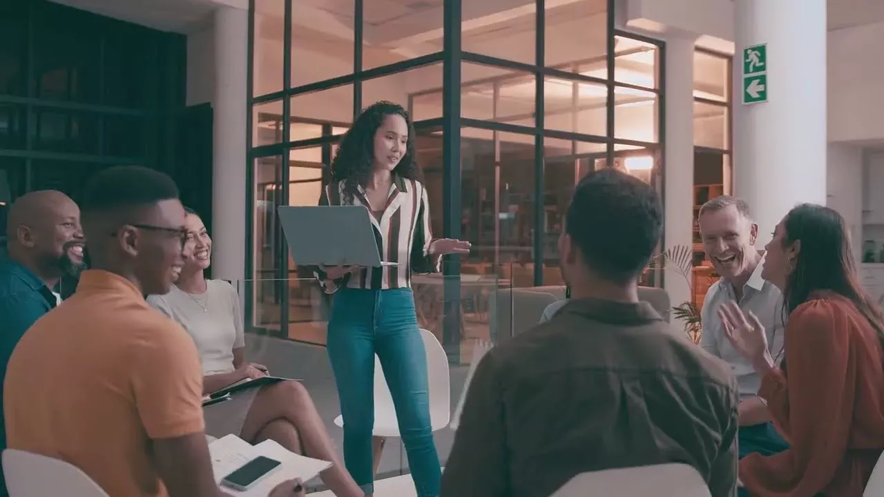 woman speaking to coworkers woman speaking to coworkers