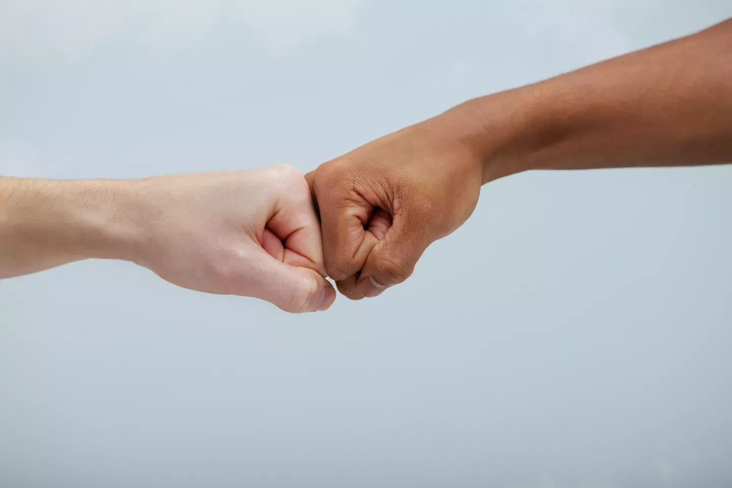Two people giving a fist bump Two people giving a fist bump