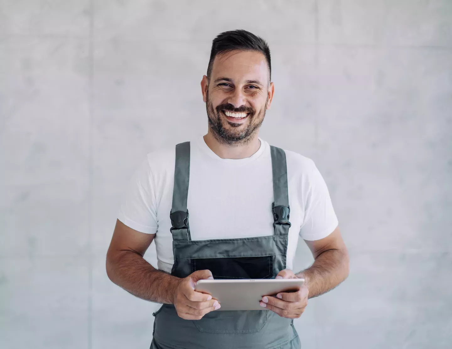 Mechanic holding a tablet Mechanic holding a tablet