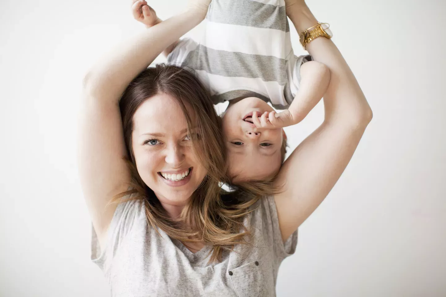Mom holder her kid upside down Mom holder her kid upside down