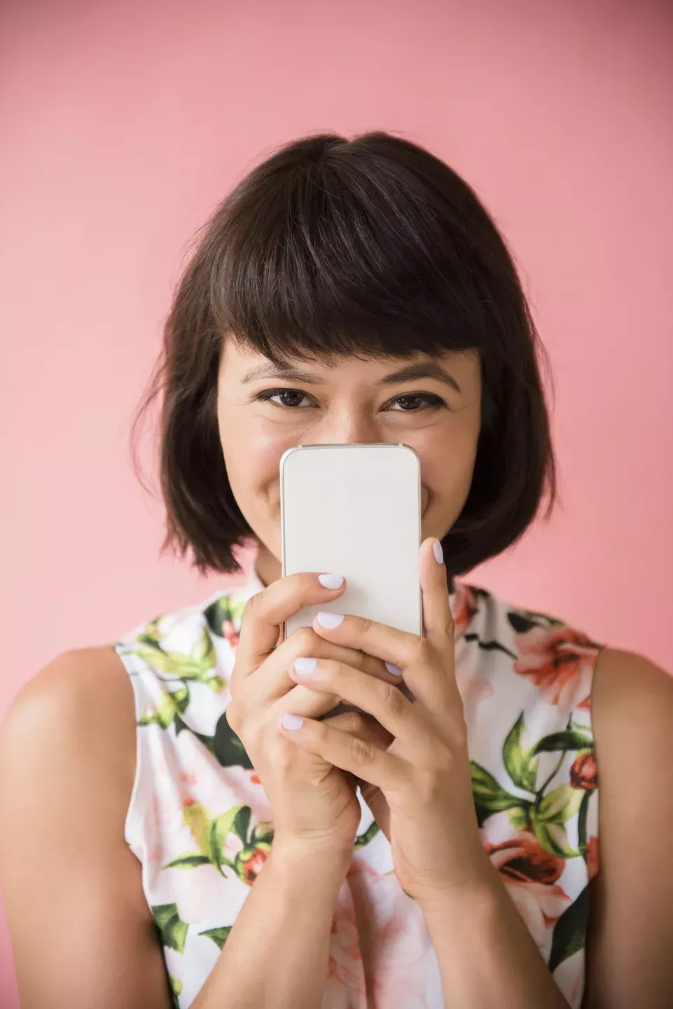 Woman hiding behind a phone Woman hiding behind a phone