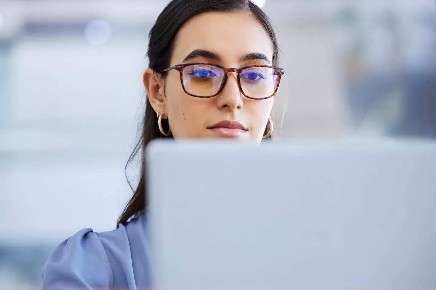 Woman looking at laptop Woman looking at laptop