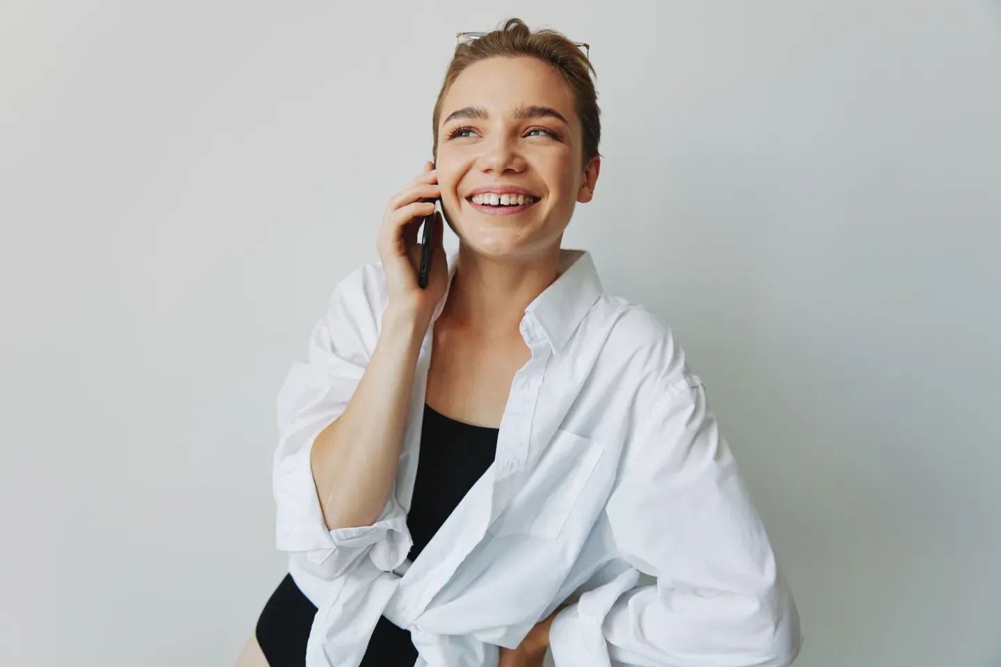 smiling person on cell phone smiling person on cell phone