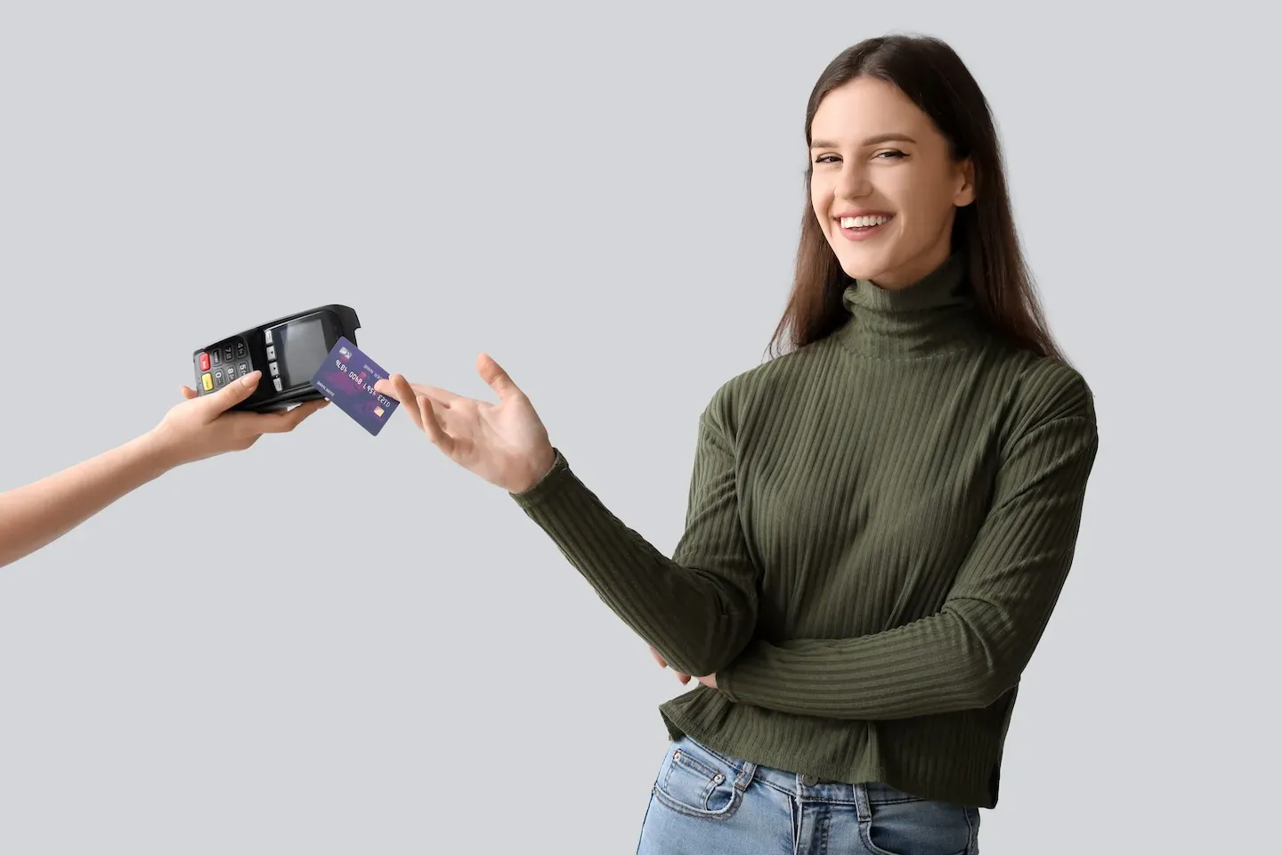 smiling woman swiping credit card smiling woman swiping credit card