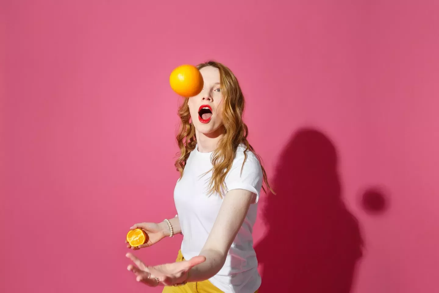 woman juggling oranges woman juggling oranges