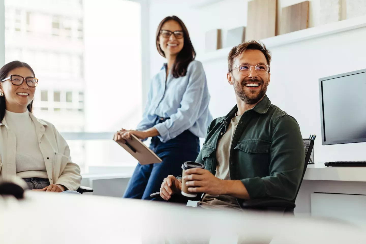 people smiling in an office people smiling in an office