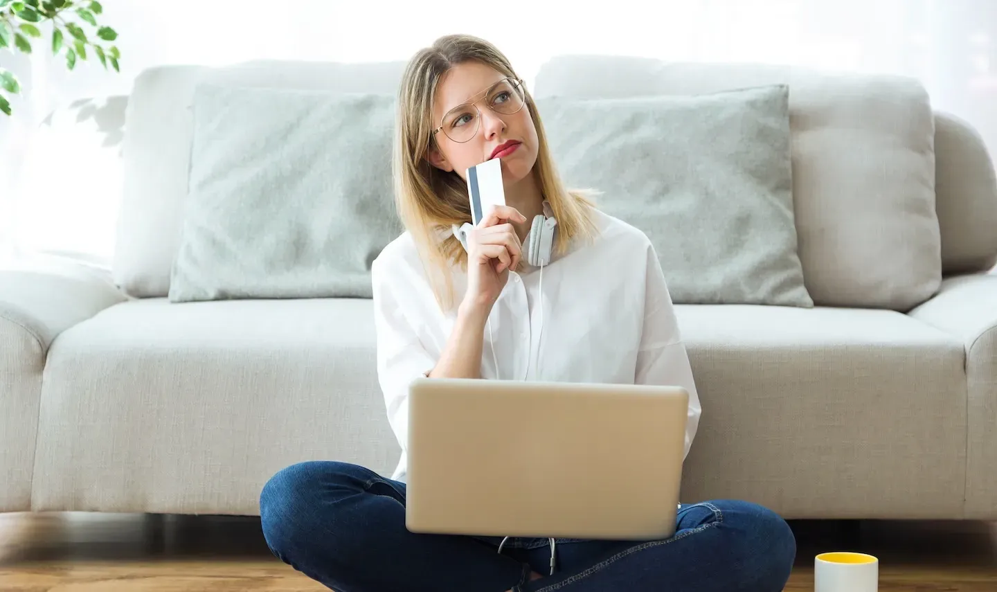 Woman Thinking Credit Card Laptop Woman Thinking Credit Card Laptop