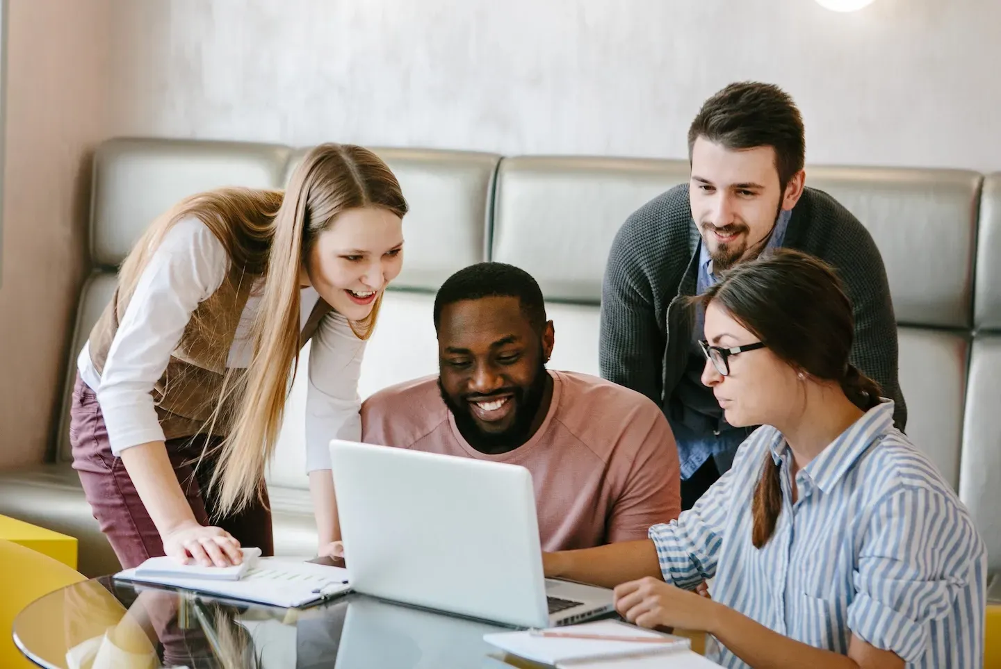 group of people looking at computer group of people looking at computer