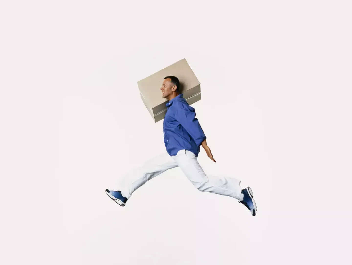 Man jumping with box Man jumping with box