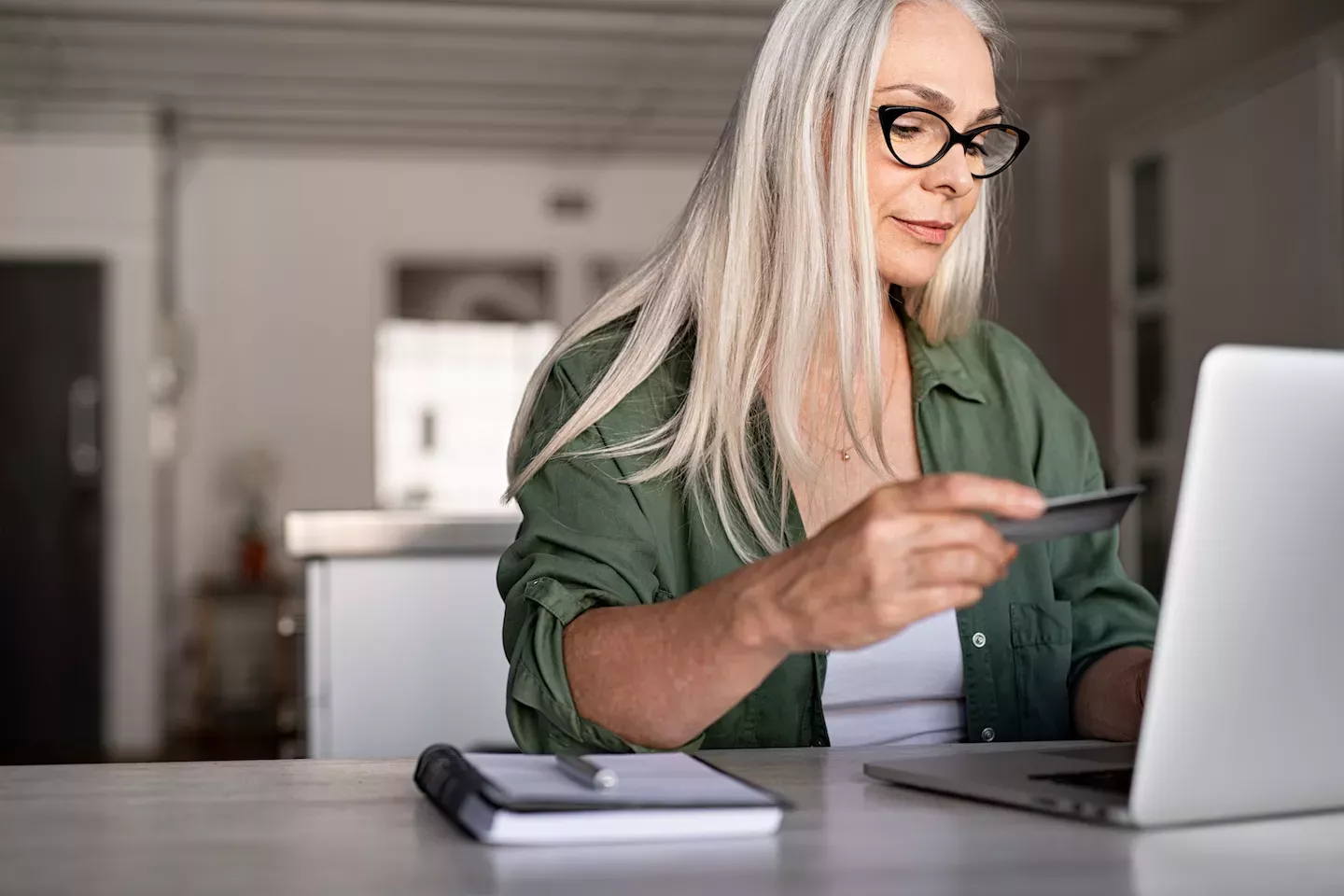 Woman with credit card and laptop Woman with credit card and laptop