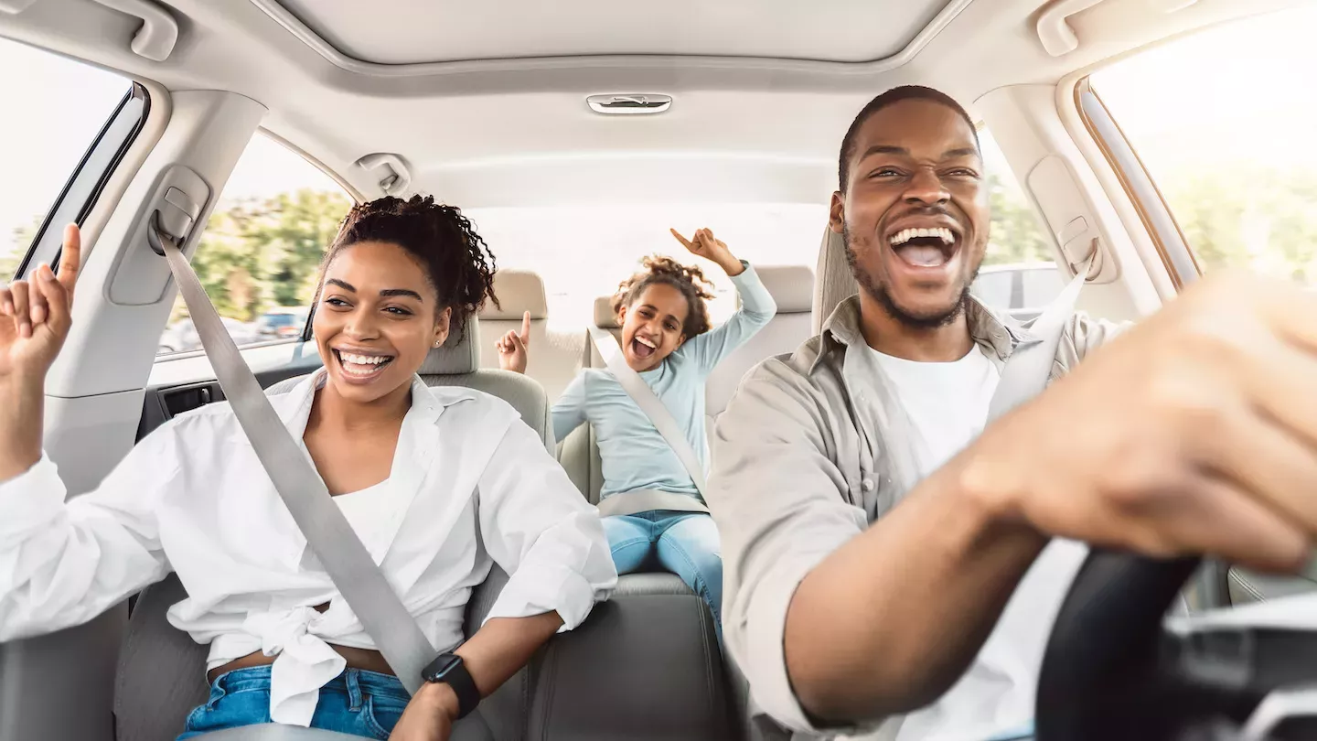 Happy family driving in a new car Happy family driving in a new car