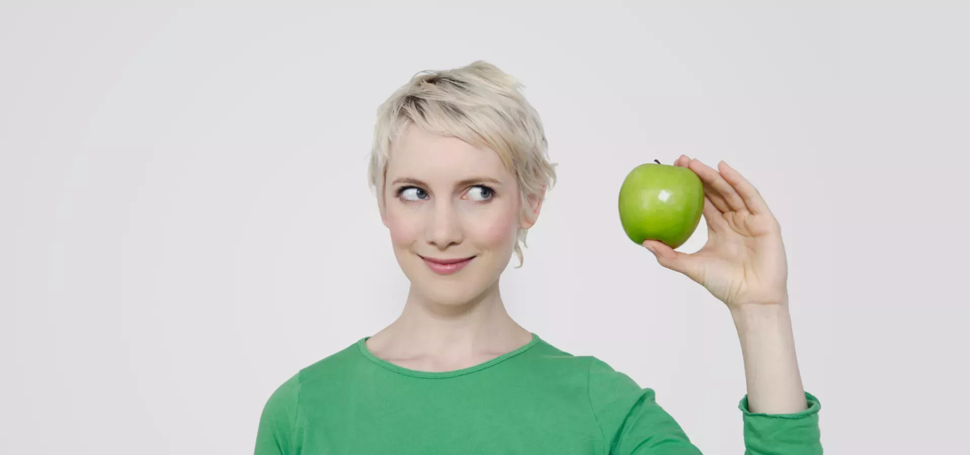 Woman holding an apple Woman holding an apple