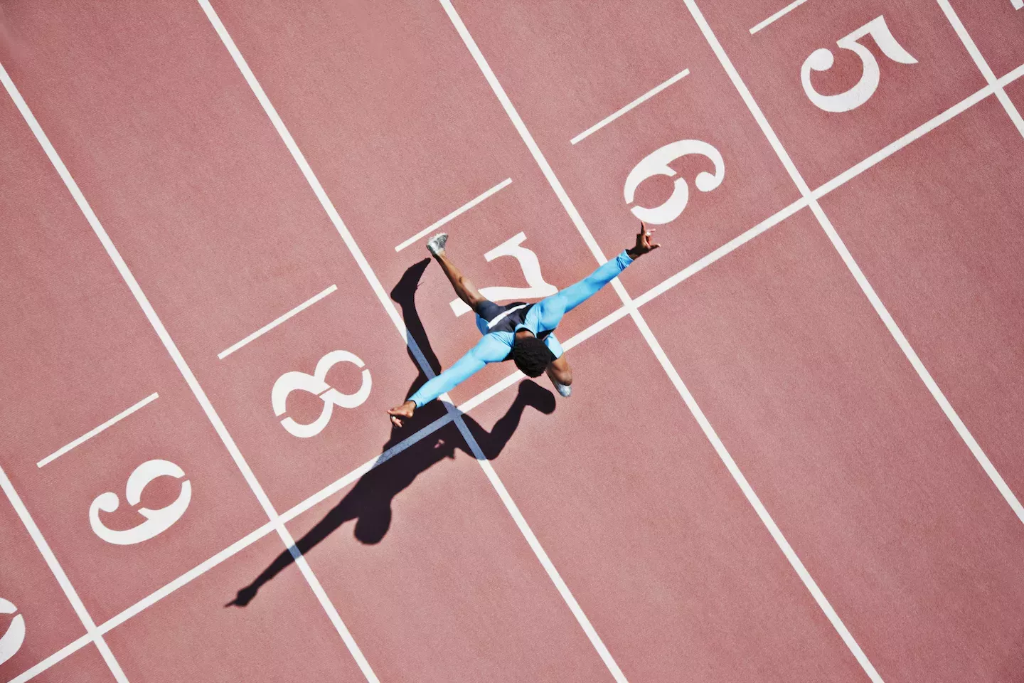 Person running a race on a track Person running a race on a track