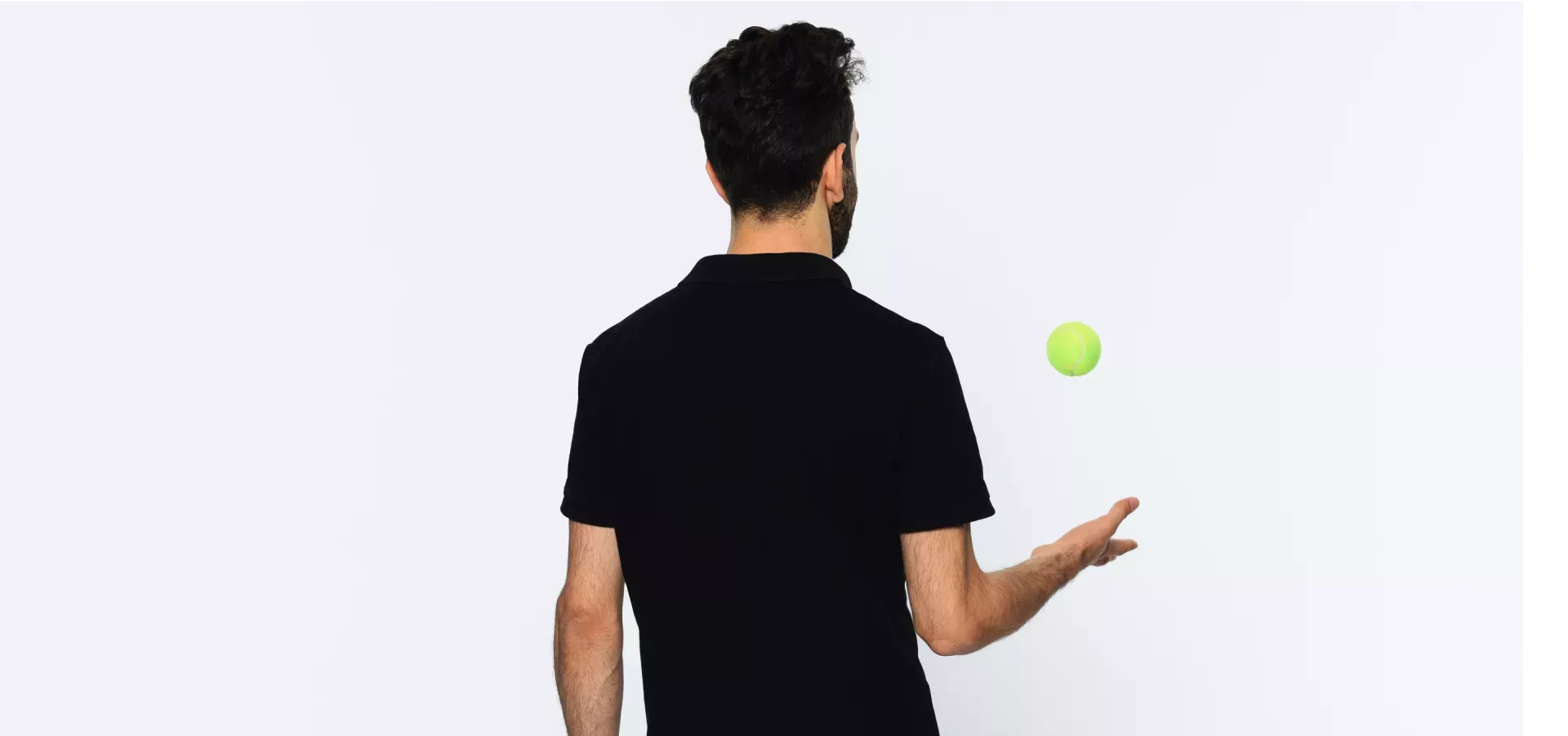 Man throwing a tennis ball Man throwing a tennis ball