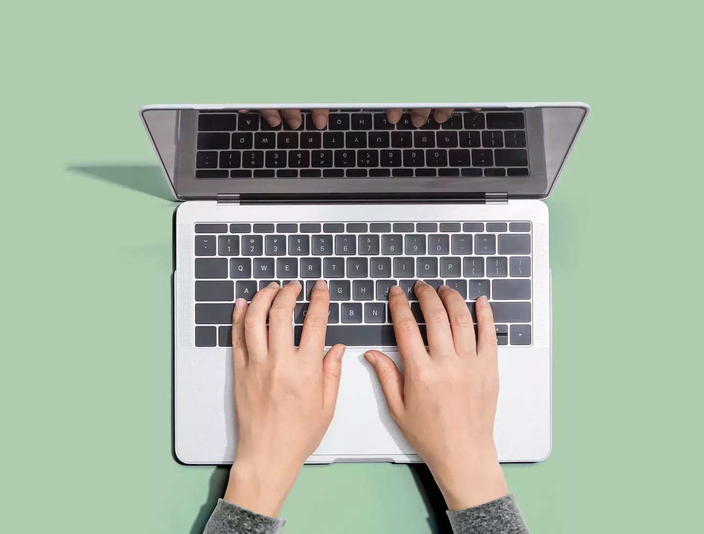 Person working at a laptop Person working at a laptop