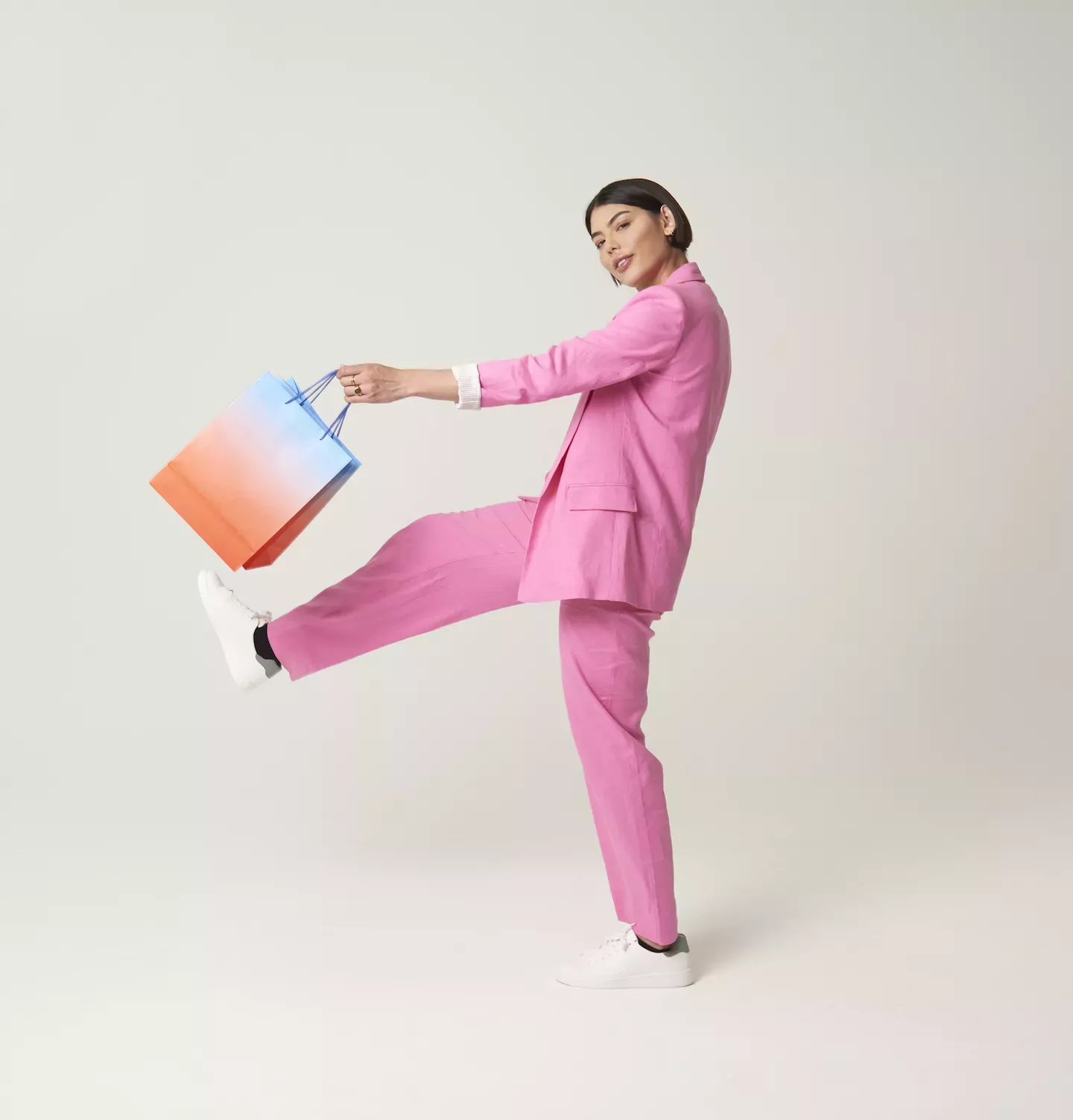 Woman with shopping bags jumping Woman with shopping bags jumping