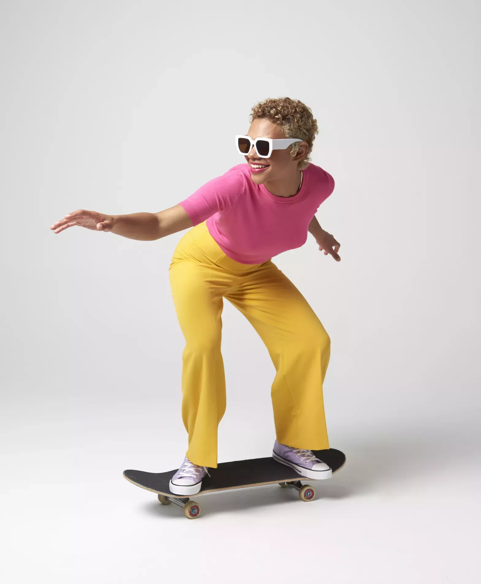 Woman riding a skateboard Woman riding a skateboard