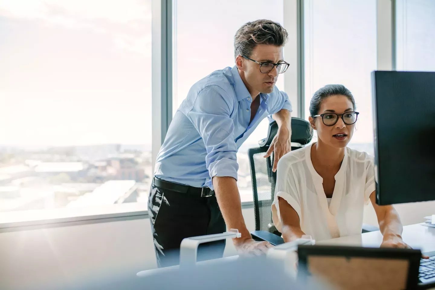 two people working in office two people working in office