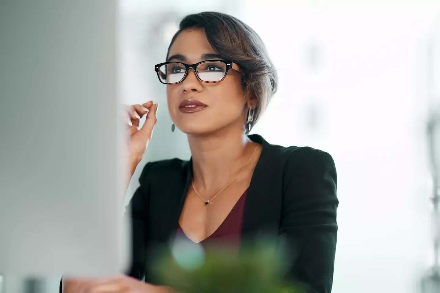 woman looking at desktop woman looking at desktop