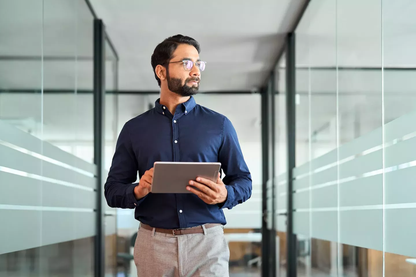 person holding tablet in business setting person holding tablet in business setting